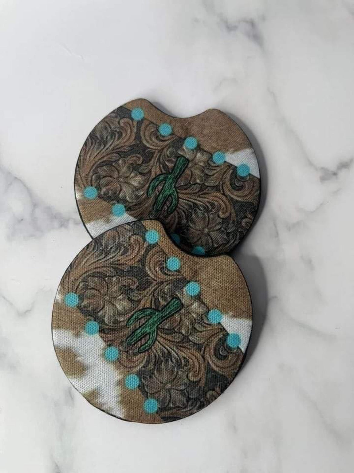 Cow print with a cactus and blue dots