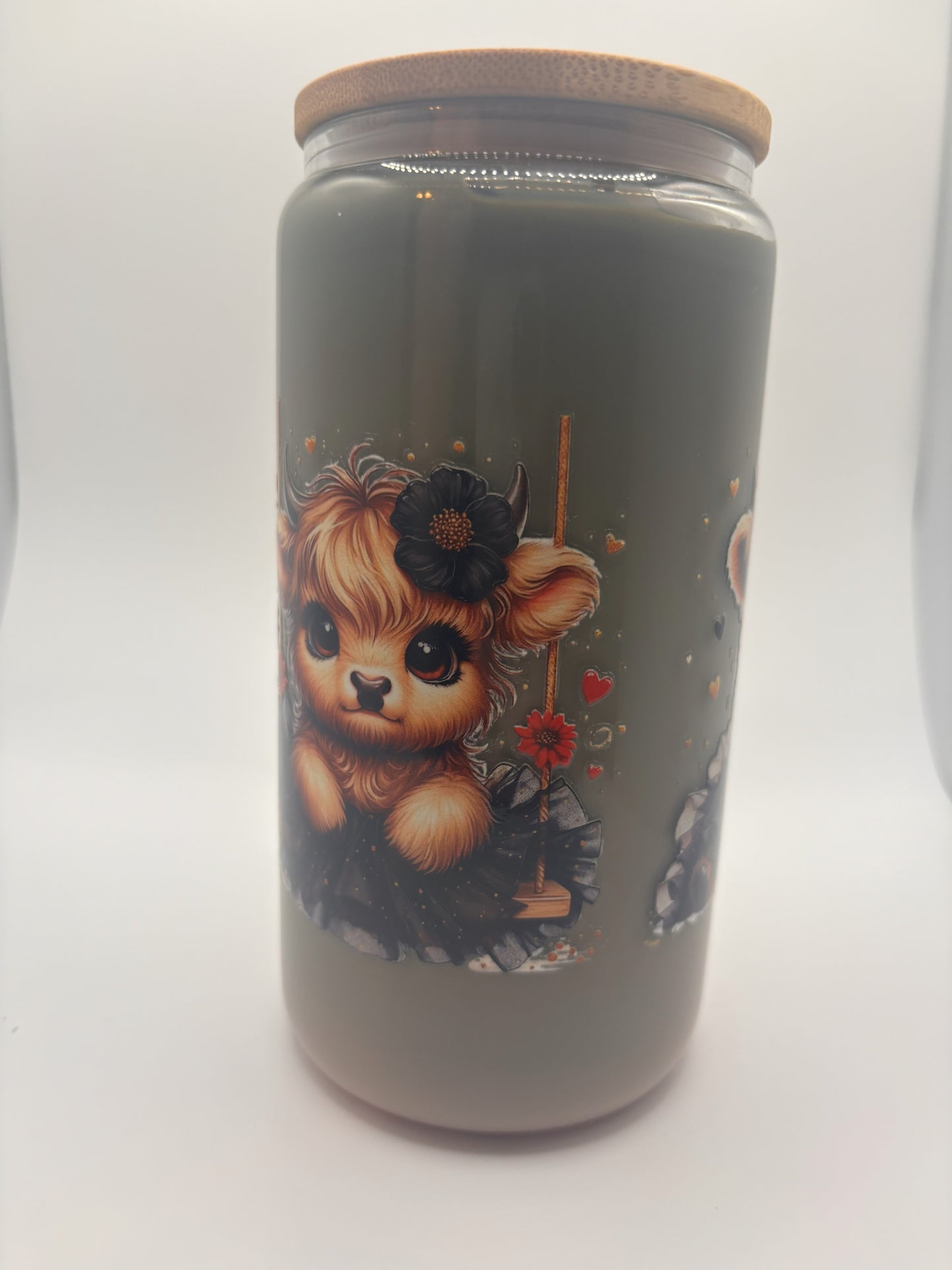 Highland cow with black tutu and bow