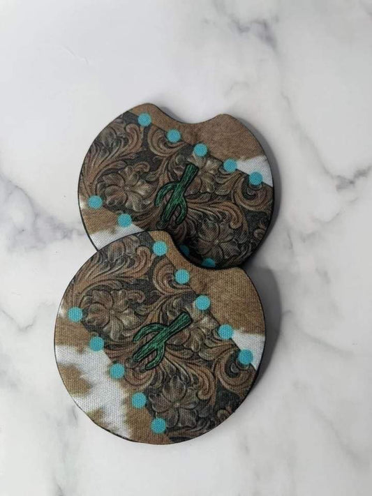 Cow print with a cactus and blue dots