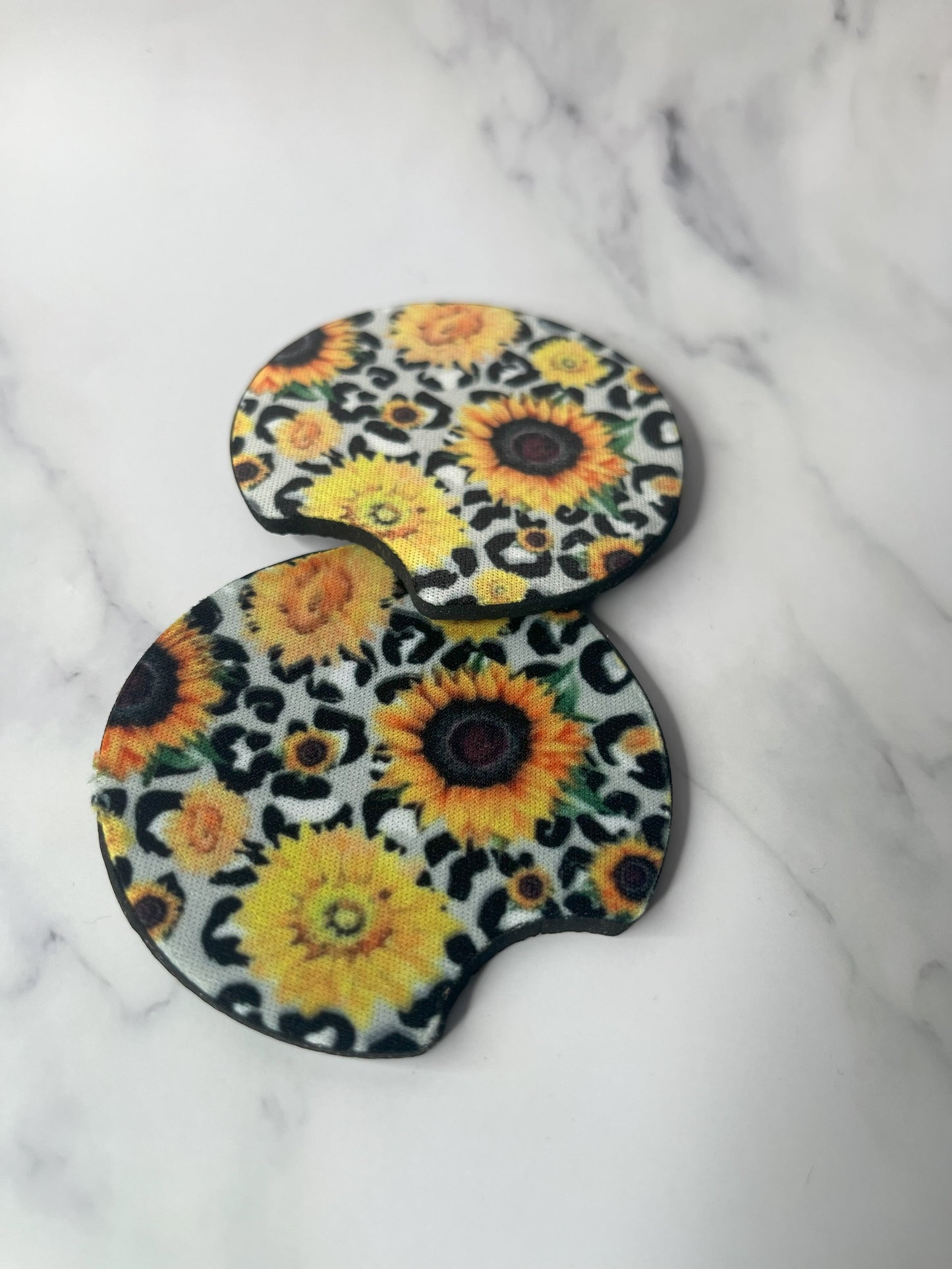 Grey leopard with sunflower